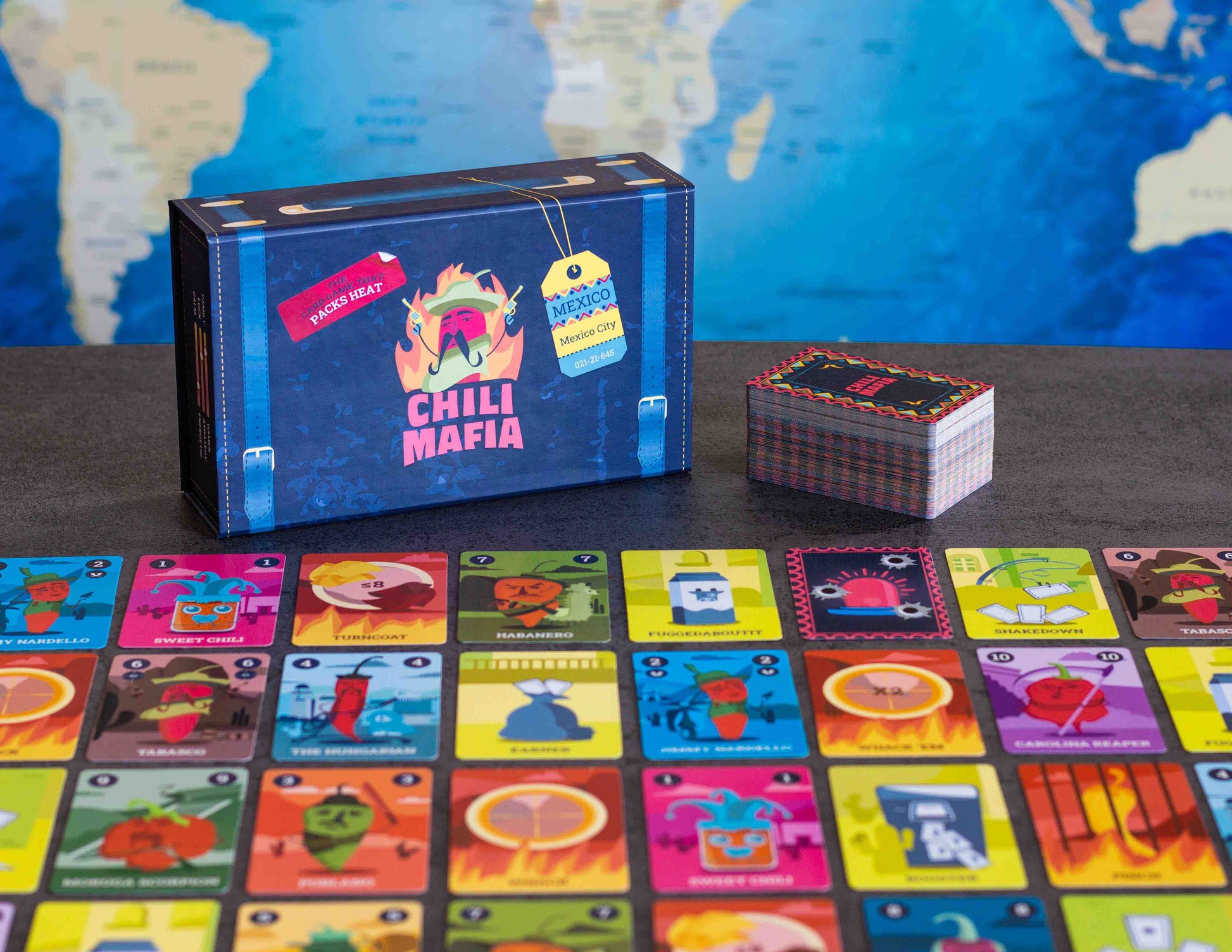 Chili Mafia box and cards. Add some spice to your next board game night with this set-collection card game for up to 8 people!
